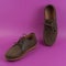 Men`s brown moccasins, loafers isolated  on pink background. Side view, top view