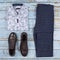 Men`s casual outfits for men clothing set with shoes, trousers, shirt on wooden background, Top view