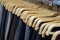 Men`s dress suits hanging on wooden hangers