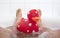 Men`s feet in a bathtub, with large rubber duck