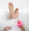 Men`s feet in a bathtub, selective focus on toes