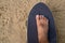 Men`s feet Without shoes, stepping on a black Surf Skate in the sand in the park