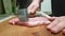 Men`s hands beat meat in the kitchen nutrition