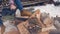 Men`s hands with a chainsaw closeup