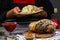 Men`s hands, close-up, holding sauerkraut, cooking Bavarian pork knuckle, home cooking concept