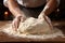 Men\\\'s hands in flour on homemade rustic organic bread. Homemade baking