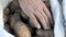 Men`s hands touch potatoes. Large potatoes in bag. Huge potato harvest close up view