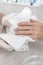 Men`s hands wiped with a towel by the beautician`s hands during a manicure treatment. A man in a beauty salon.