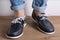 Men`s legs in blue shoes, comfortable summer moccasins, concept