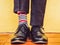 Men`s legs, stylish shoes and colorful socks