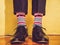 Men`s legs, stylish shoes and colorful socks