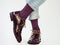 Men`s legs, trendy shoes and bright socks