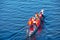 Men\'s rowing team on the blue water. Winter training