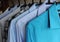 Men`s shirts on hangers, blue, gray and checkered