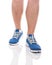 Men`s sports legs in sneakers.