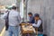 Men sew on sewing machines on the street. Quito, Ecuador. 01/13/2019