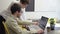 Men sitting inside office working building project on computer