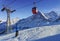 Men on ski near cable railway on winter sport resort in swiss al