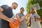 Men with smartphone on basketball playground