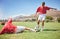 Men, soccer and slide tackle in sports fitness, training and exercise on the field outdoors. Athletic man tackling