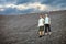 Men standing on stones slope