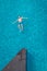 Men in swimming pool , guy in blue swim short from above in swim pool, drone view from above