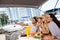 Men taking selfie with three girls on yacht