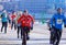 Men with thick hoarfrost on their faces run during the Christmas half-marathon in Omsk at minus 23