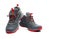 Men trekking shoes isolated on white background. Gray-red hiking shoes. Safety footwear for climbing. Adventure gear. Lightweight