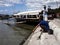 Men tries to catch fish using a fishing pole at the Binangonan Fish Port and Terminal