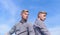 Men twins brothers muscular guys posing in shirts sky background. Menswear and fashion concept. Men strong athlete wear