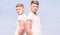 Men twins brothers muscular guys in white shirts sky background. Brotherhood concept. Benefits of having twin brother