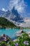 men visiting Lago di Sorapis in the Italian Dolomites,blue lake, Lake Sorapis Dolomites, Italy.