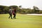 Men, walking and golf course for sports, game challenge and exercise for hobby in summer travel outdoor. Golfer or