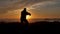 Men warrior monk practicing silhouette tai chi karate kung Fu on the rocky stones horizon at sunset or sunrise. Chakra