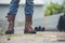 Men wear construction Boots safety footwear for worker at construction site. Engineer Wear Jeans Brown Boots Worker on Background