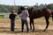 Men wiping down winning thoroughbred horse near the Winners Circle,Saratoga Racetrack,2015