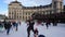 Men women children skate on ice rink in winter. Christmas eve in Munich Germany