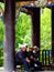 Men and Women sitting in front of Budhist village and temple in china Tibet