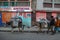 Men and women  with their beasts of burden(burros opr donkeys) in the streets of Cap Haitien.