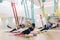 Men and women training yoga by hammocks for Anti-gravity air flying yoga. Wellness for man and woman lifestyle at yoga studio.