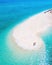 men and women walking on a sandbar in the ocean of Koh lipe Southern Thailand during vacation