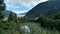 Mendenhall Glacier in Juneau Alaska. Large Glacier sliding into a lake with a waterfall beside it. Very popular tourist stop