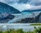 Mendenhall Glacier in Juneau, Alaska surrounded by majestic mountains