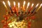 Menorah with candles and chocolate coins Hanukkah and Judaic holiday symbol