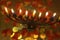 Menorah with lighted candles and chocolate coins Hanukkah and Judaic holiday symbol