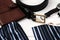Mens accessories - wallet, belt, cufflinks, watch, handkerchief and ring on a white wooden background