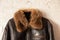 Mens black leather winter jacket with fur collar close-up