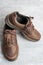 Mens brown leather walking shoes on textured background