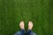 Mens feet standing on grass